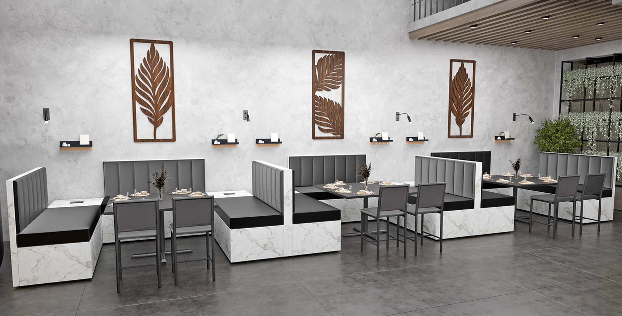 Contemporary modular restaurant seating featuring neutral fabric, sleek black frames, and marble-style bases in a modern dining interior.