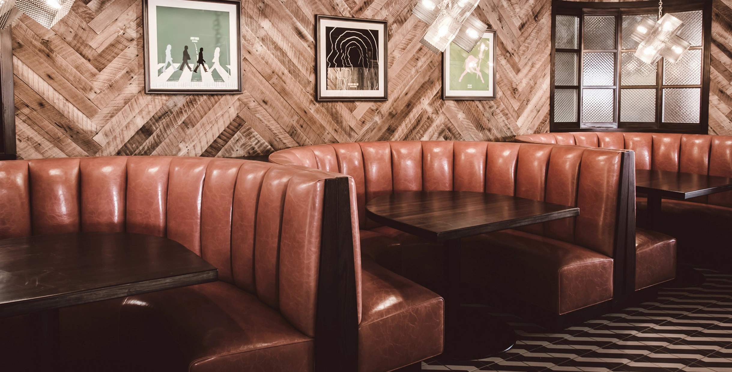 Circular Restaurant Booth Designs to Elevate Dining Spaces6 Circular restaurant booth installation by Mingmeng Furniture in a modern dining space with wooden wall design and ambient lighting