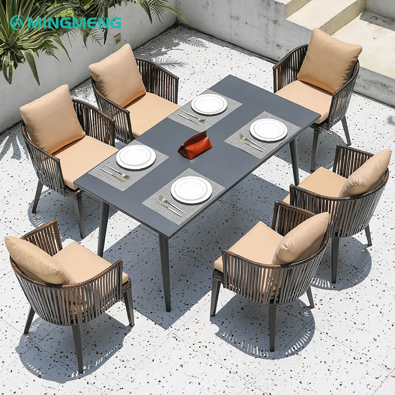 Outdoor Aluminum Frame Rattan Chair | Handwoven PE Wicker Patio Chair1 Modern outdoor rattan dining set with gray aluminum table and beige cushion chairs by MINGMENG