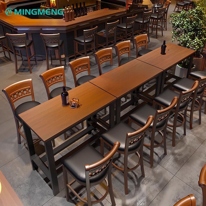 Vintage Dark Walnut Bar Stool3 Modern restaurant interior featuring Mingmeng wooden bar stools with black leather seats paired with long wooden dining tables and matching bar counter seating.