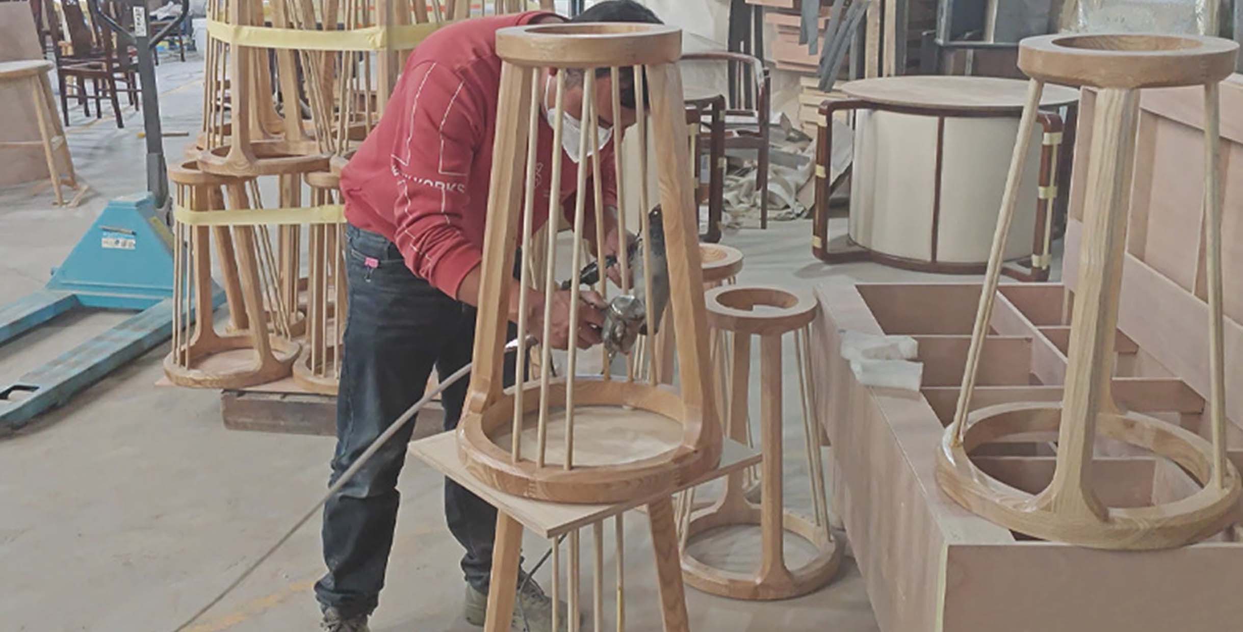 How to Source Commercial Restaurant Supplies Furniture Directly from Factory1 Factory workers assembling and finishing wooden restaurant furniture frames inside Mingmeng’s production workshop, showcasing craftsmanship and manufacturing quality.