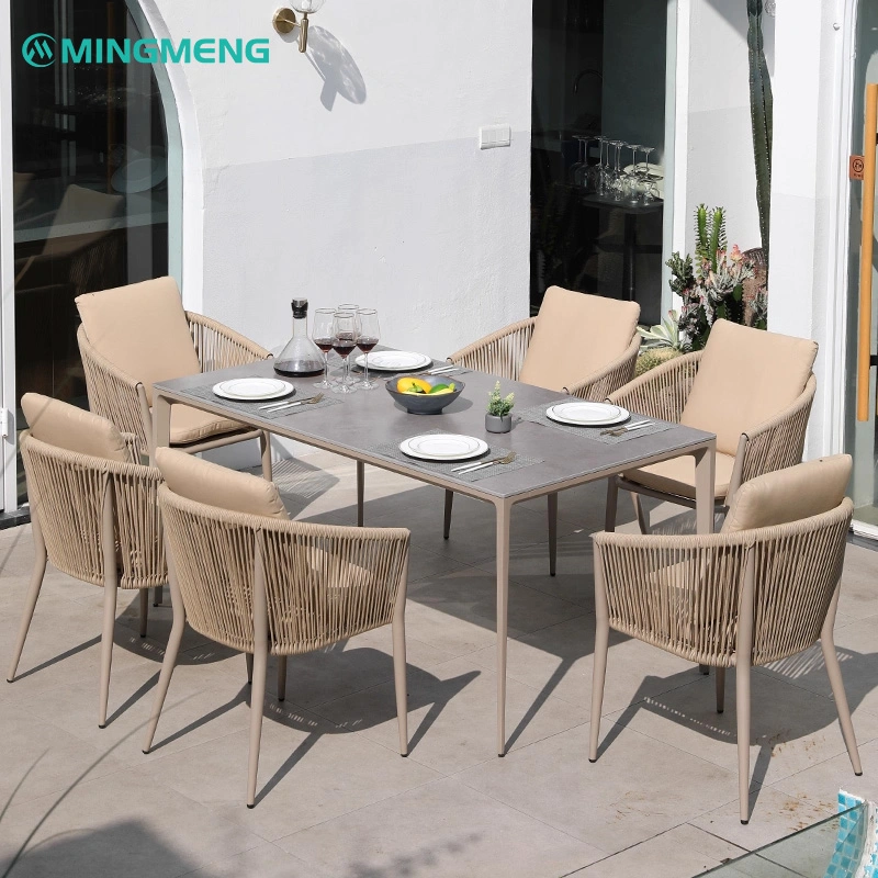 Outdoor Garden Dining Table With Sintered Stone Top3 Modern outdoor dining table set featuring a sleek gray ceramic tabletop and six beige rope chairs, perfect for restaurants, patios, and outdoor dining spaces.