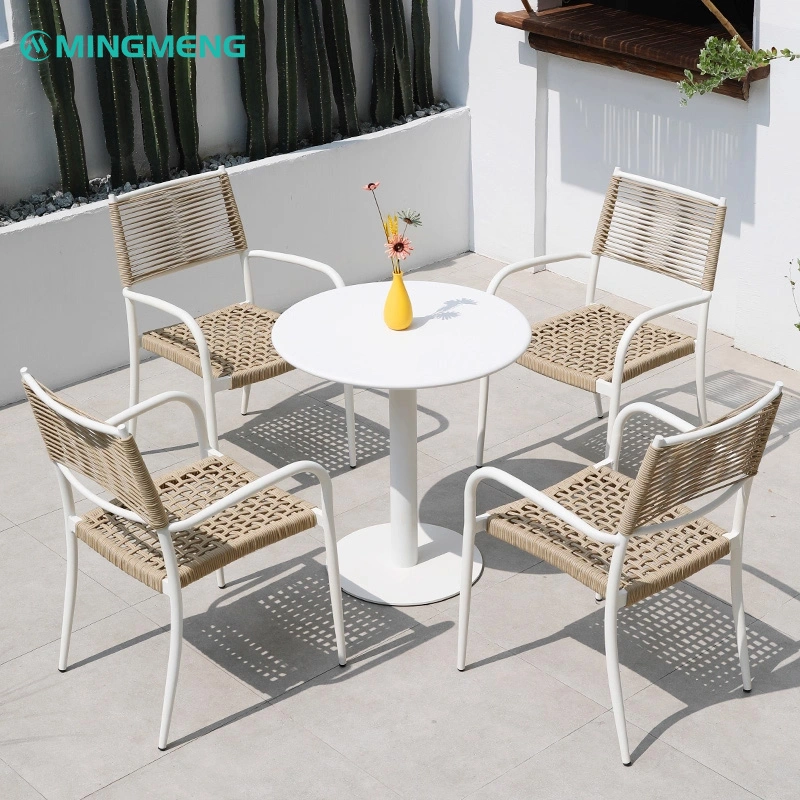 Custom White Outdoor Garden Dining Table2 White outdoor round table and four chairs with woven seats in a sunny garden setting