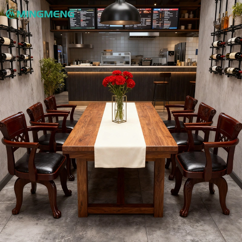 Designer Mid-Century Restaurant Chair2 Restaurant dining space featuring wooden table, dark wood restaurant chairs with black leather seats, and red flower centerpiece